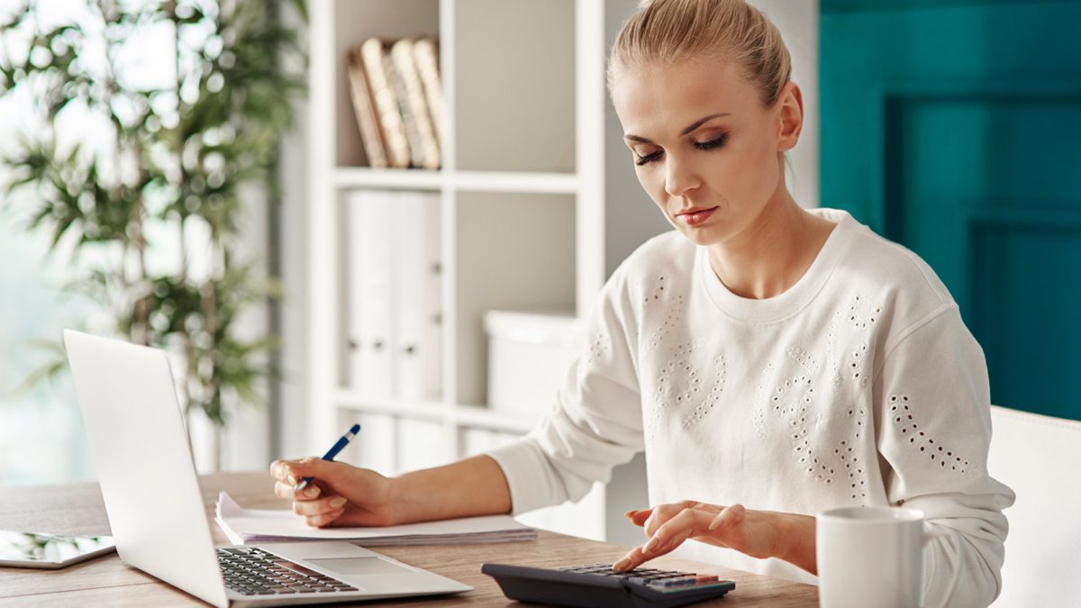 concentrated-woman-budgeting-at-office-RVS7TEP